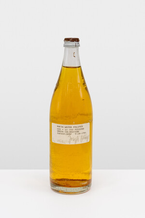 Joseph Beuys - Rhine Water Polluted, 1981, bottle containing green-dyed Rhine water, label, screwcap with oil paint (Browncross)